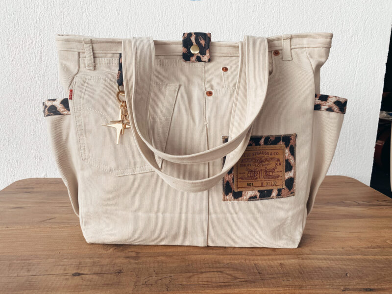 Side view of sustainable tote bag with soft denim straps