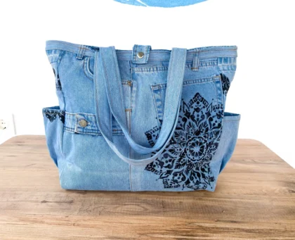 Recycled denim shoulder bag in light blue with black print design